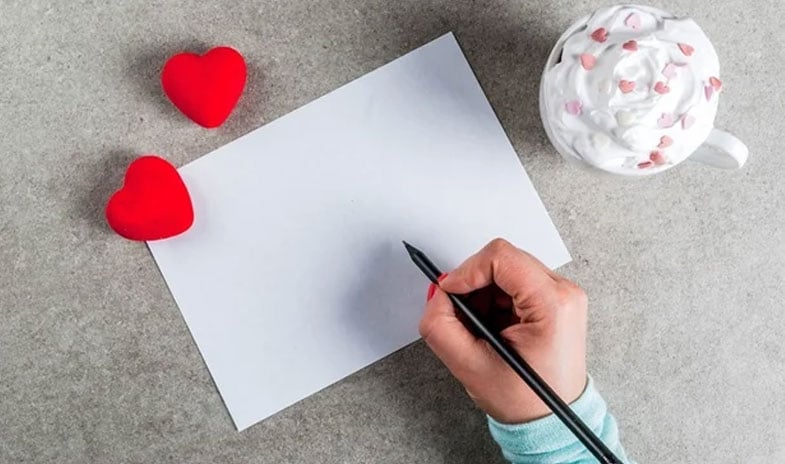 Apex-blog-valentines-hybrid-office-high-angle-hands-about-to-write-on-the-paper