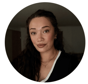 Professional headshot of Lacy Mehau with long dark hair wearing a black and white top