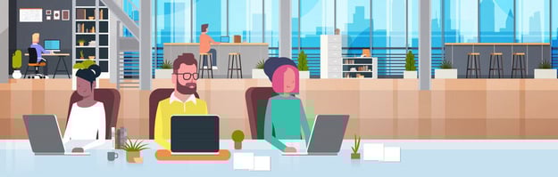A bright modern office space with three people working at laptops, large windows with city views.