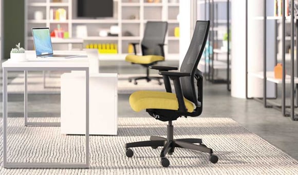 Office chair with ergonomic design set up in a minimalistic workspace.