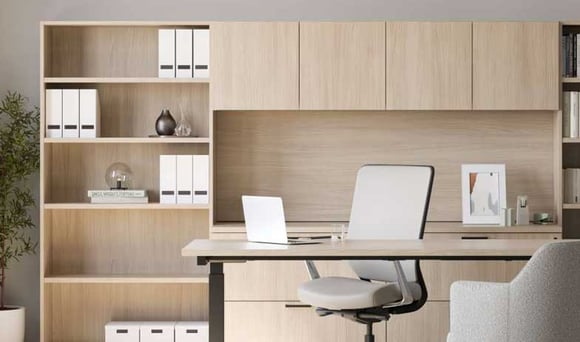 Modern home office with sleek white desk, ergonomic chair, and organized shelving.