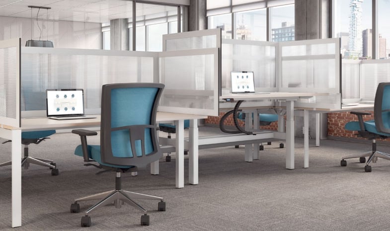 Contemporary office workspace with three cubicles, each equipped with transparent screens and height-adjustable tables, promoting an open and adaptable work environment.